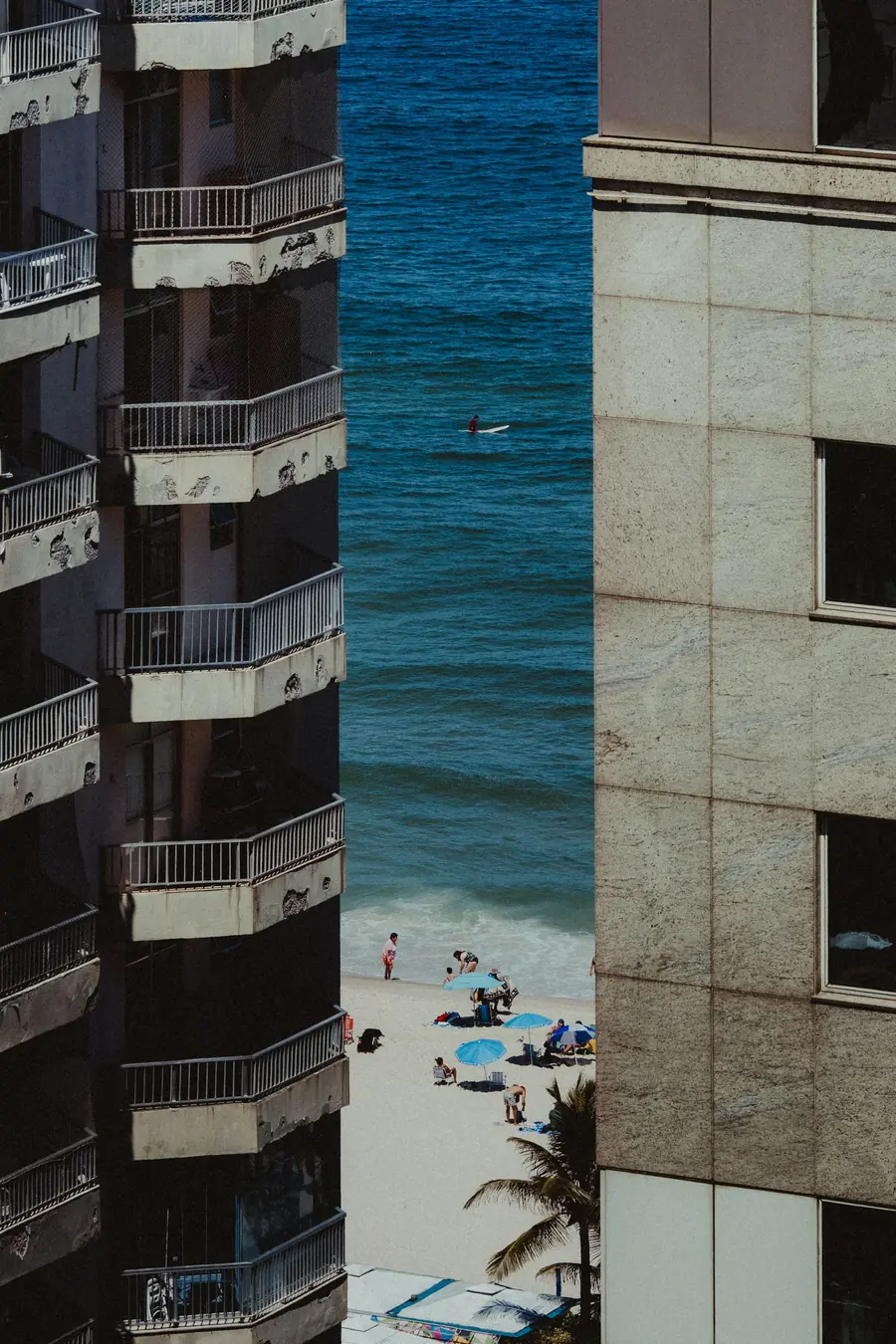 The sea appearing between buildings in Ipanema